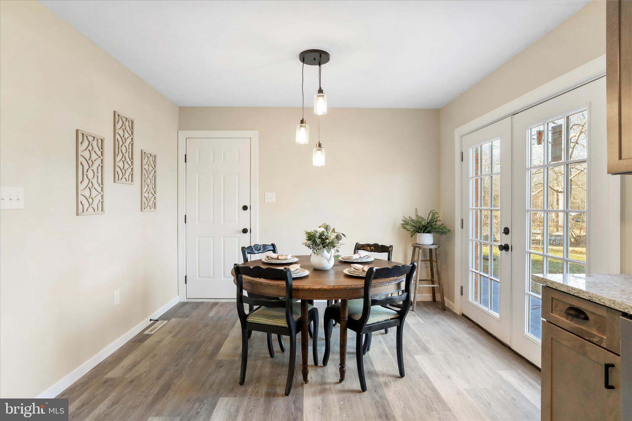 1517 Kendrick Ford Road Front Royal, VA 22630 - Photo 11 of 39 a view of a a dining room with furniture window and wooden floor