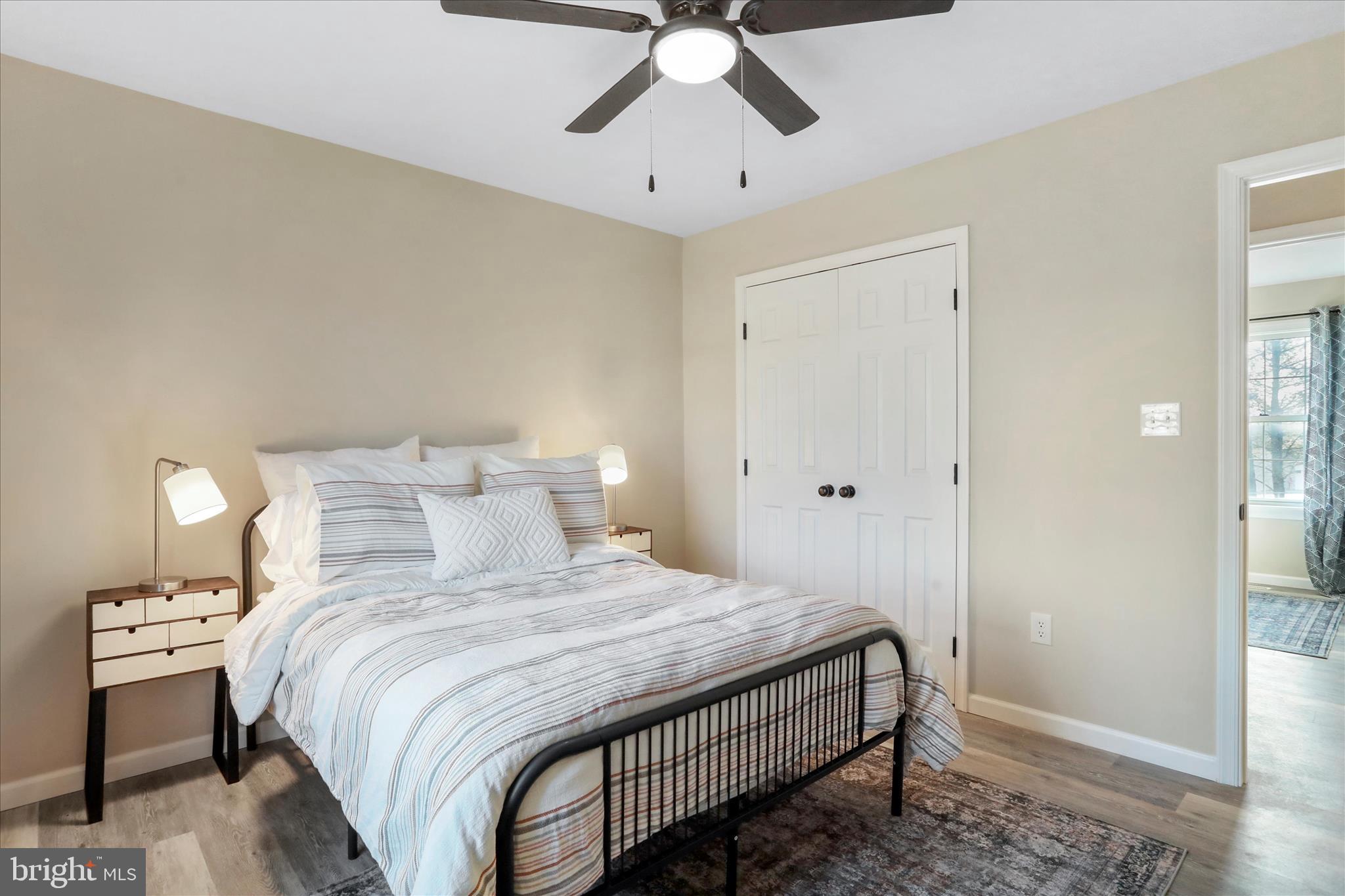 1517 Kendrick Ford Road Front Royal, VA 22630 - Photo 15 of 39 a bedroom with a bed and a chandelier