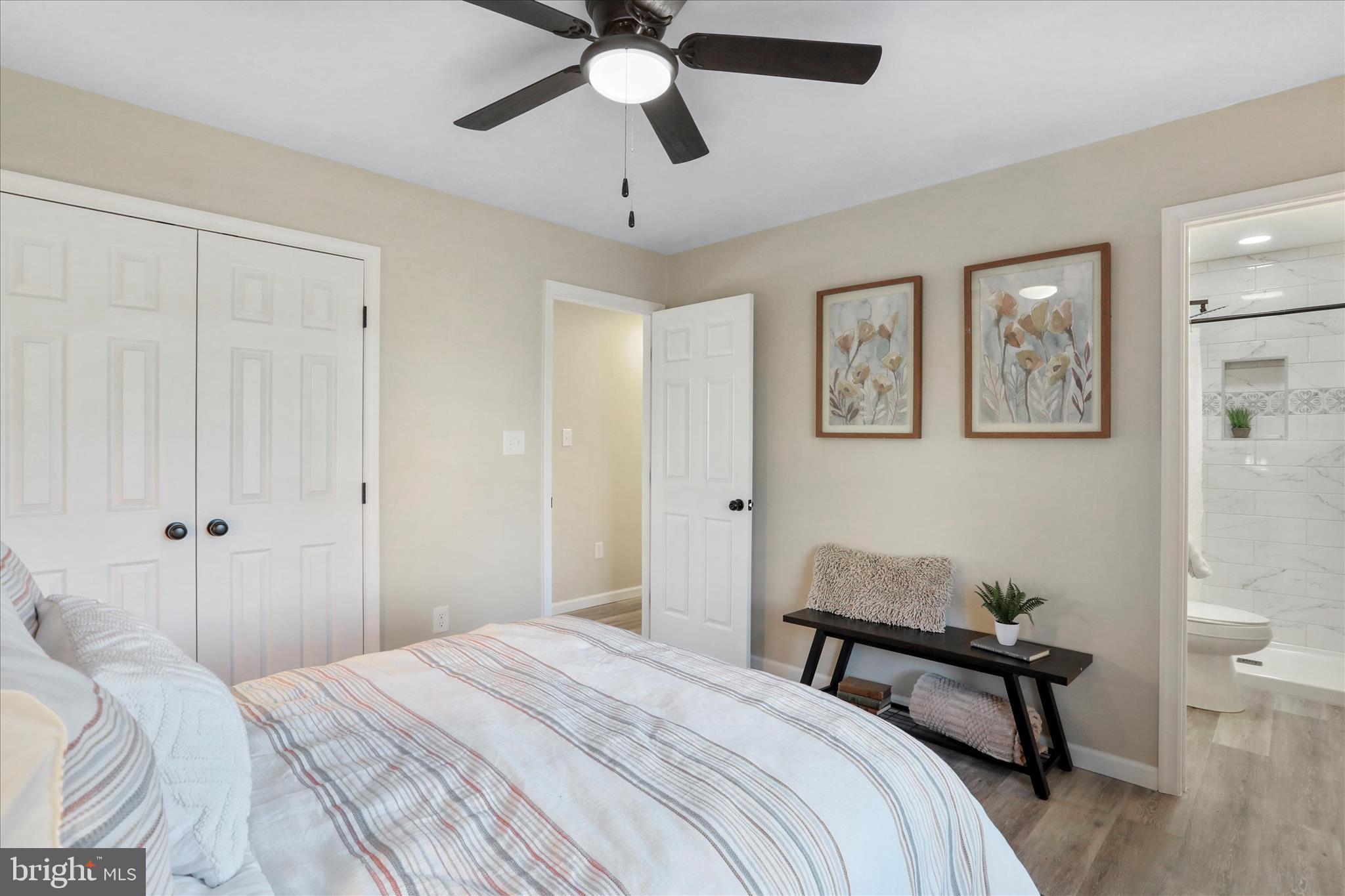 1517 Kendrick Ford Road Front Royal, VA 22630 - Photo 16 of 39 a bedroom with a bed and a chandelier