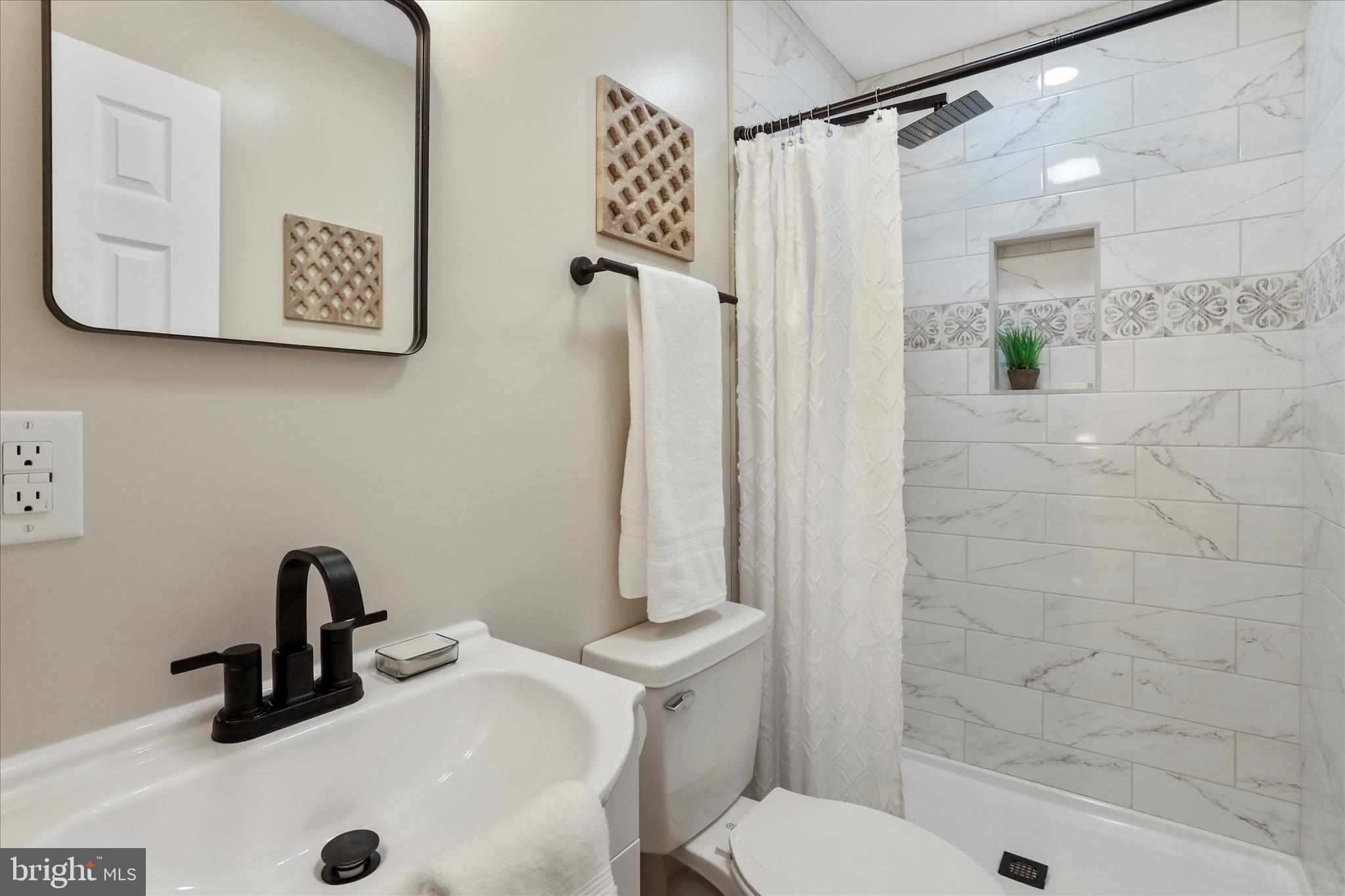 1517 Kendrick Ford Road Front Royal, VA 22630 - Photo 17 of 39 a bathroom with a sink a toilet and shower