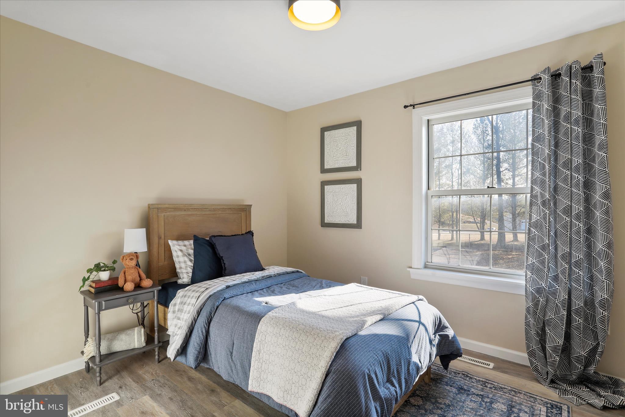 1517 Kendrick Ford Road Front Royal, VA 22630 - Photo 21 of 39 a bedroom with a bed and a window