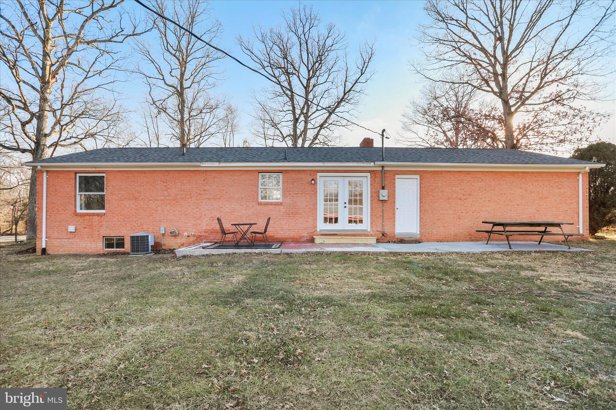 1517 Kendrick Ford Road Front Royal, VA 22630 - Photo 36 of 39 a backyard of a house with table and chairs