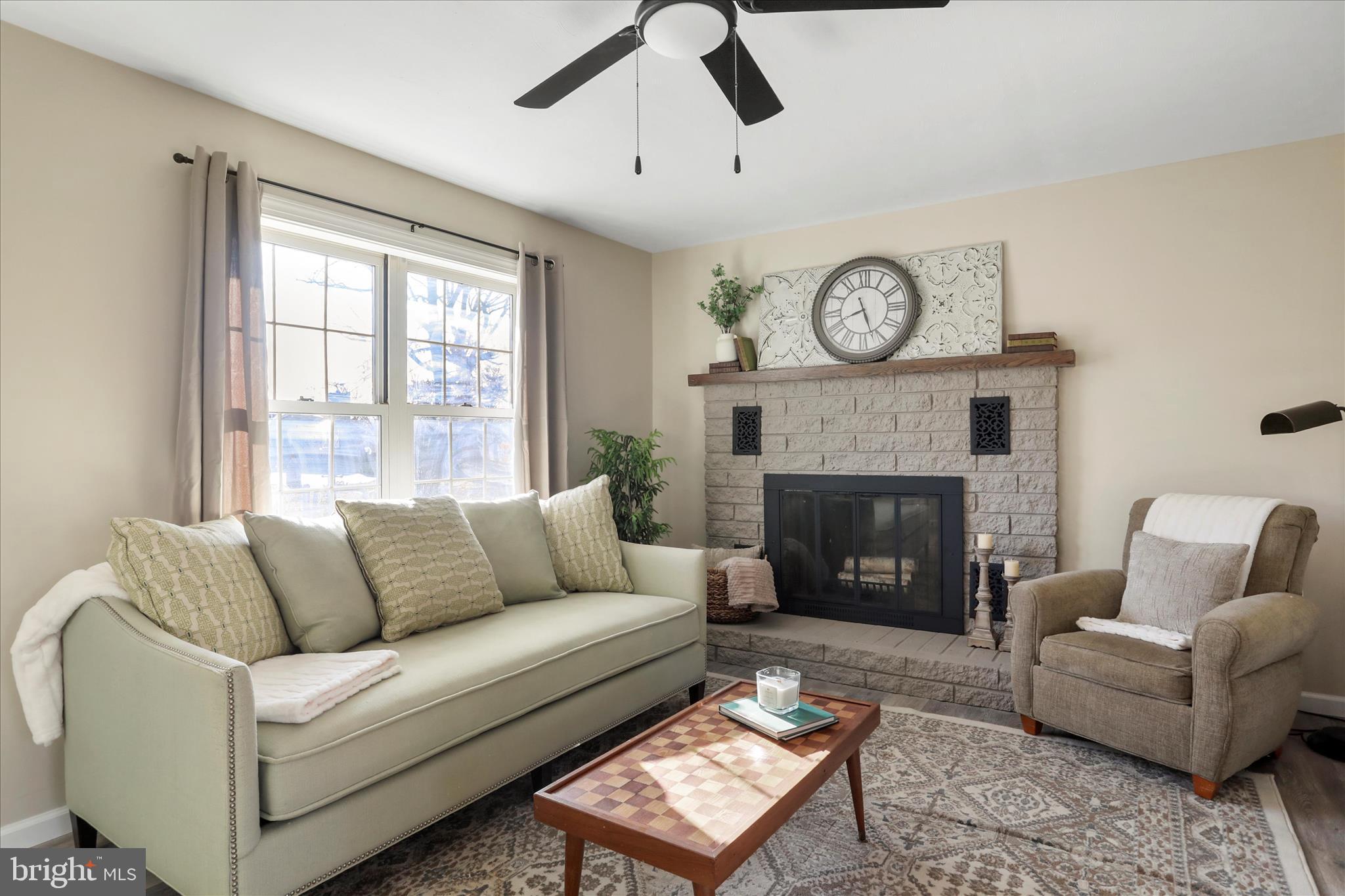 1517 Kendrick Ford Road Front Royal, VA 22630 - Photo 6 of 39 a living room with furniture a fireplace and a large window