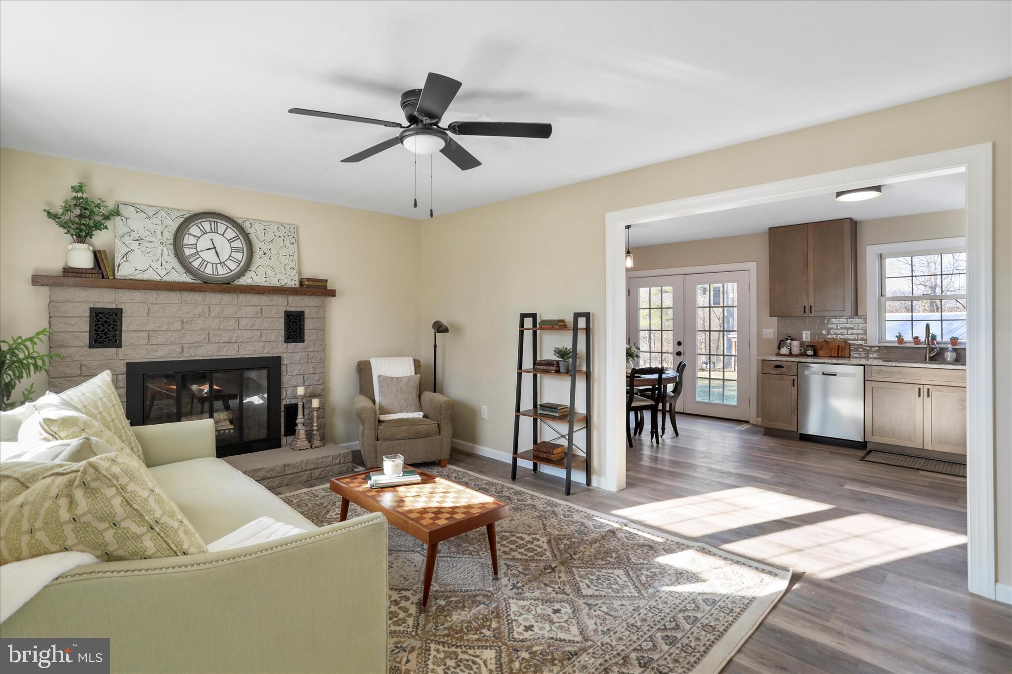 1517 Kendrick Ford Road Front Royal, VA 22630 - Photo 7 of 39 a living room with furniture a fireplace and a table
