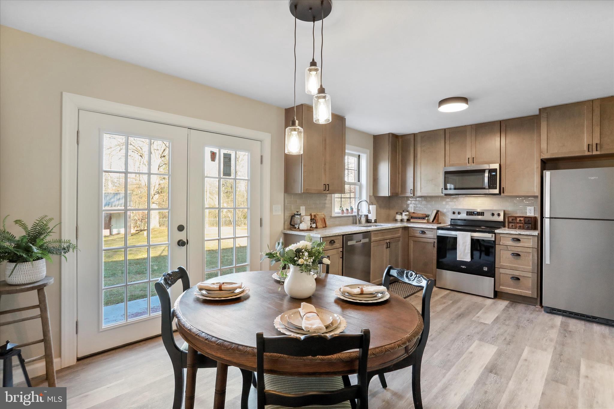 1517 Kendrick Ford Road Front Royal, VA 22630 - Photo 10 of 39 a view of a dining room with furniture window and wooden floor