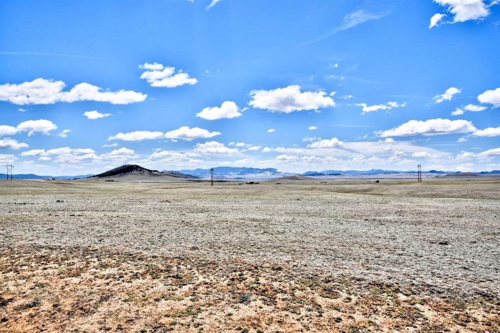 6483 Larimer Road Hartsel, CO 80449 - Photo 14 of 20 a view of a lake from a yard