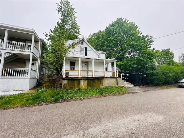 a view of a house with pool and windows