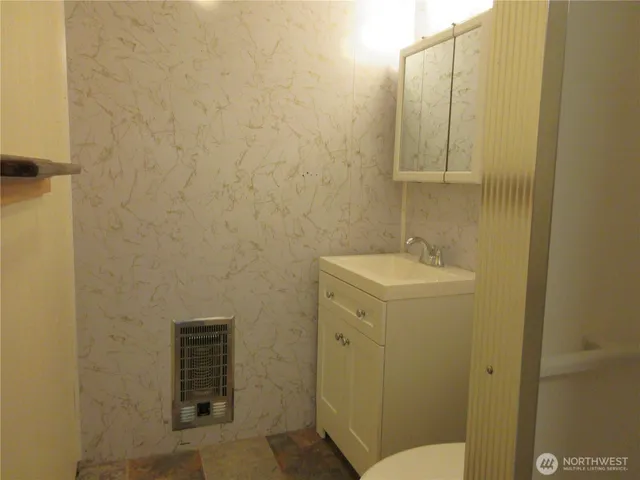 a view of an empty room with glass door