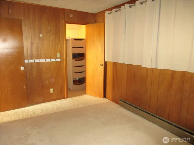 a view of a room with wooden walls