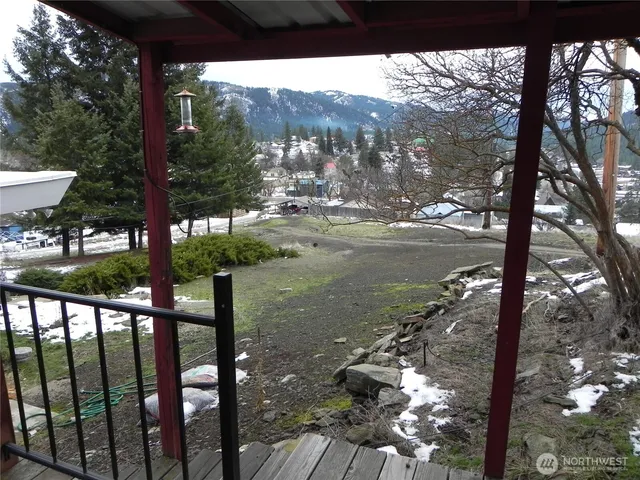 a backyard of a house with outdoor seating