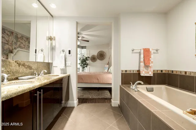 a bathroom with a bathtub and a sink