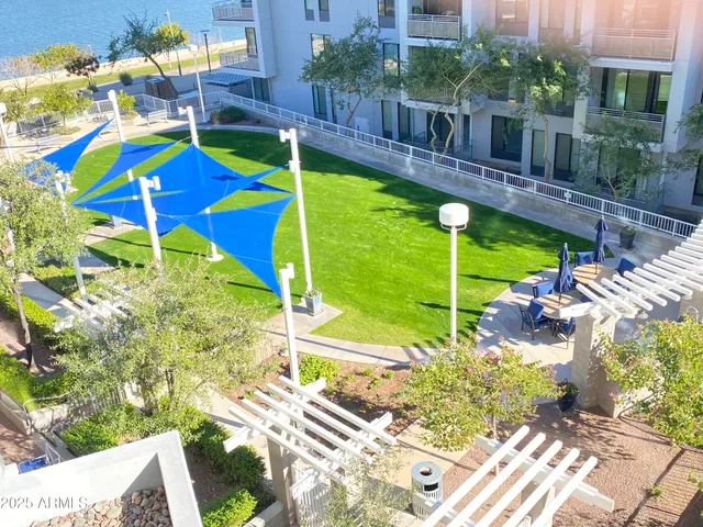 a view of a backyard with plants and patio