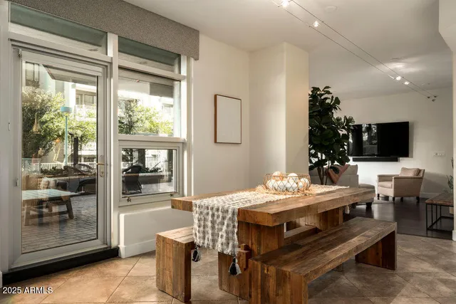 a view of a dining room with furniture and window