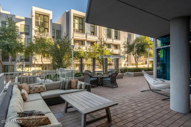 a building outdoor space with patio furniture