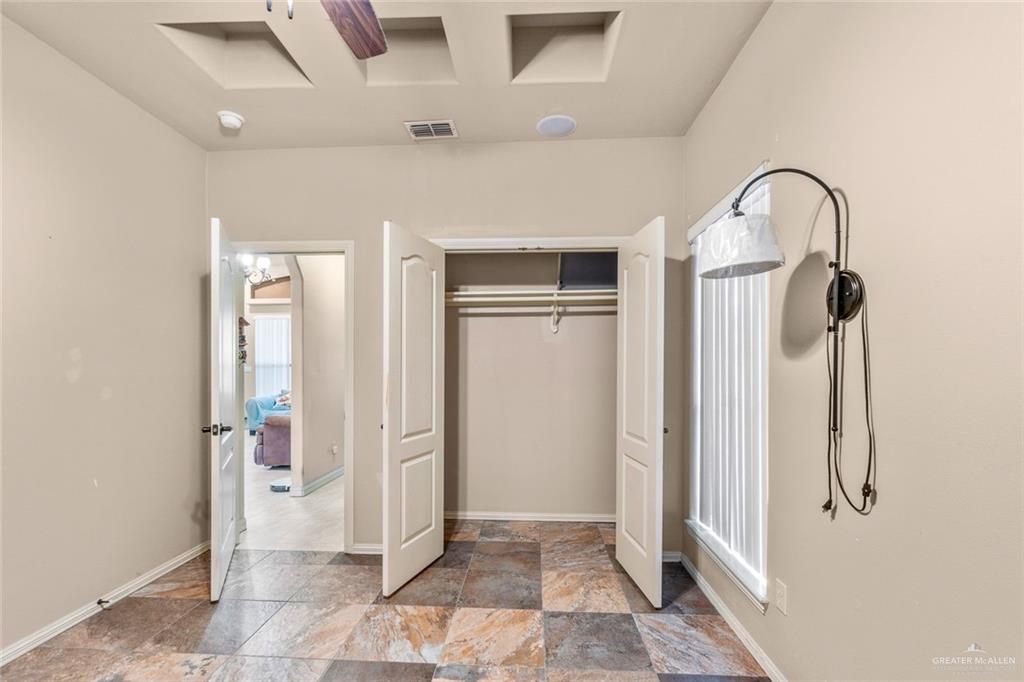 2904 Victoria Street Hidalgo, TX 78557 - Photo 16 of 25 Unfurnished bedroom with a closet and light stone finish flooring