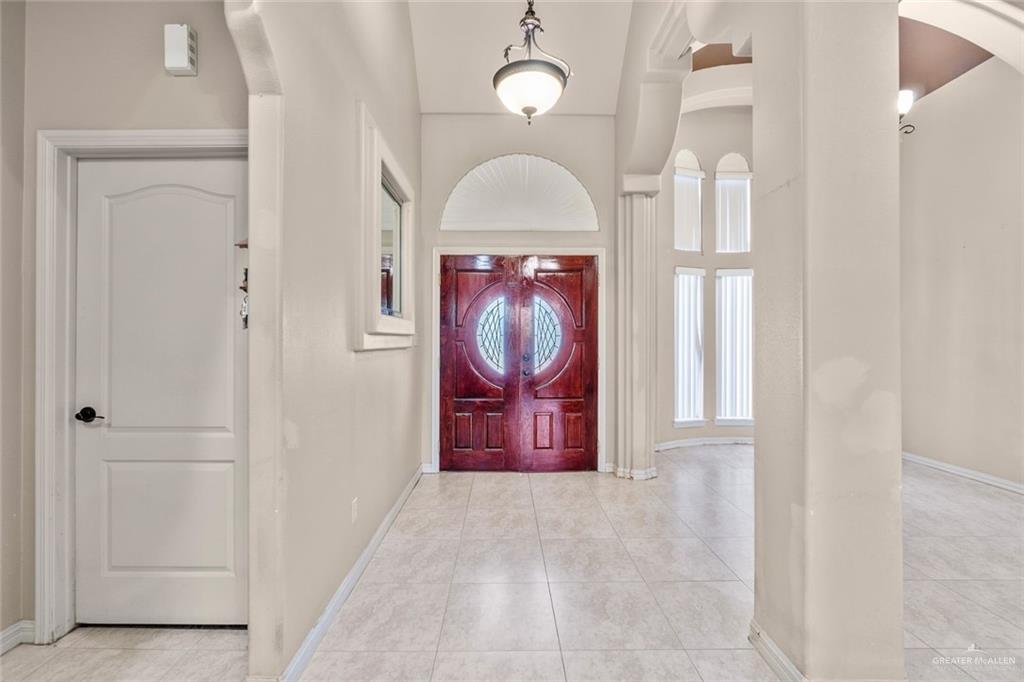 2904 Victoria Street Hidalgo, TX 78557 - Photo 6 of 25 Foyer featuring light tile patterned floors, arched walkways, and a high ceiling