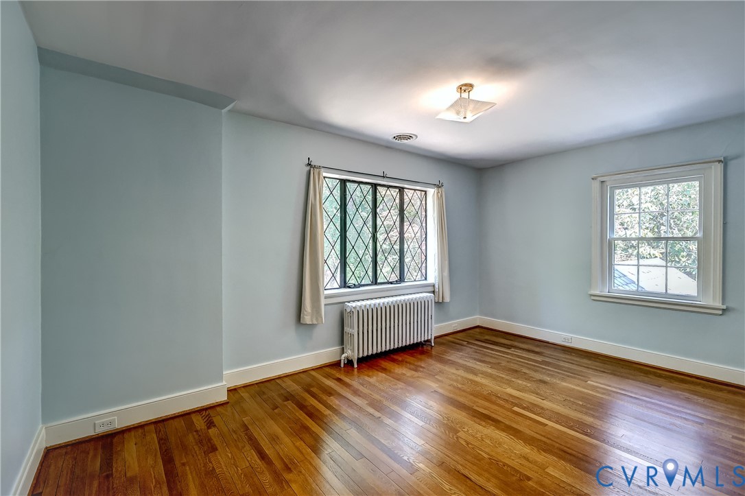 4814 Riverside Drive Richmond, VA 23225 - Photo 25 of 39 a view of an empty room with wooden floor and a window