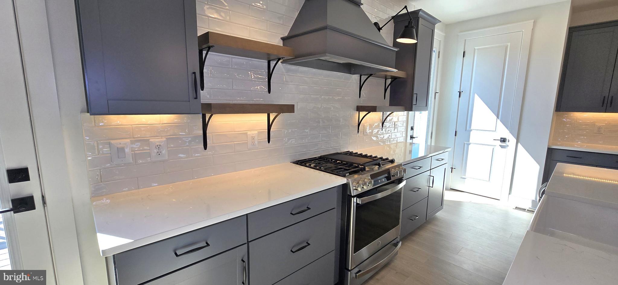1726 Blacksmith Way Frederick, MD 21702 - Photo 24 of 64 a kitchen with stainless steel appliances a stove and a refrigerator