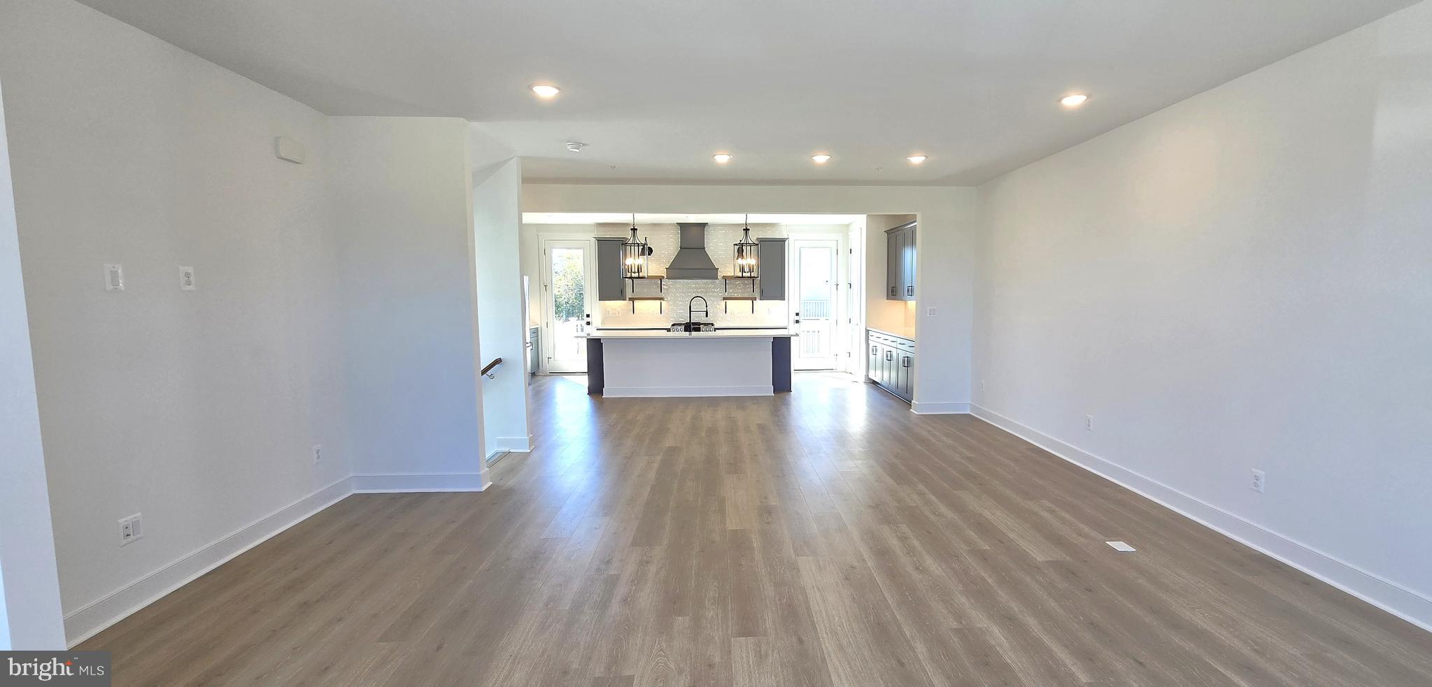 1726 Blacksmith Way Frederick, MD 21702 - Photo 34 of 64 a view of a kitchen with wooden floor and a window