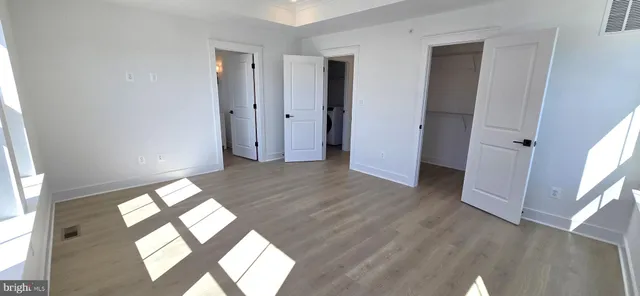 a bathroom with a sink and mirror with toilet