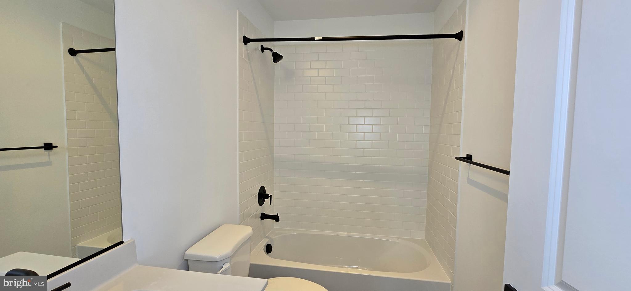 1726 Blacksmith Way Frederick, MD 21702 - Photo 47 of 64 a bathroom with a bathtub and a shower