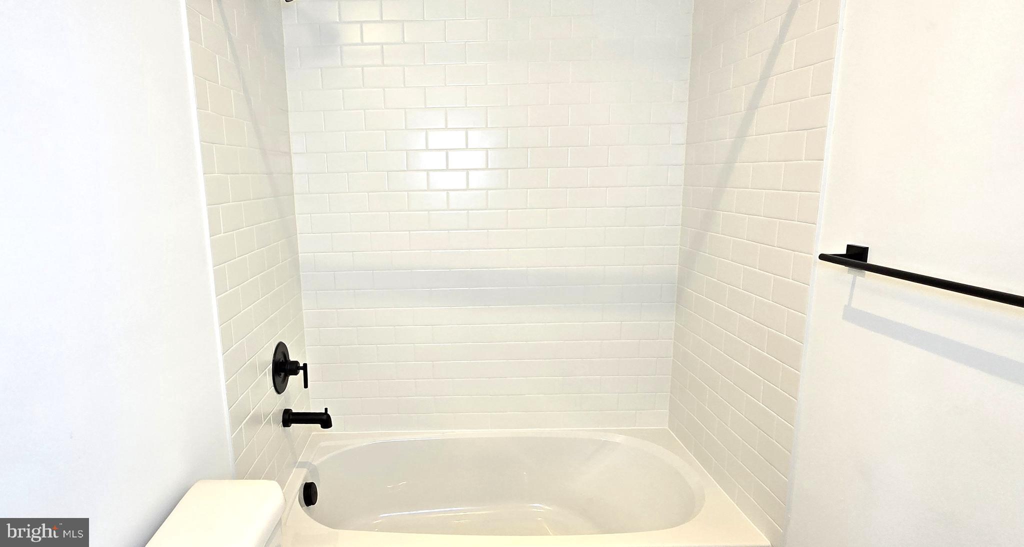 1726 Blacksmith Way Frederick, MD 21702 - Photo 48 of 64 a bathroom with a bathtub