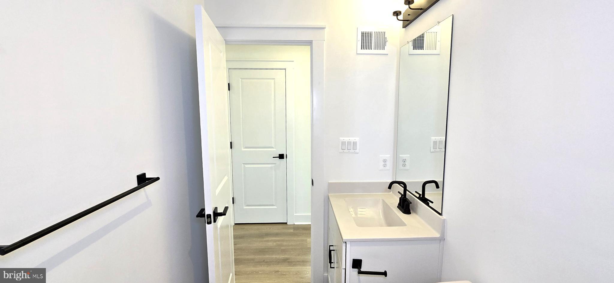 1726 Blacksmith Way Frederick, MD 21702 - Photo 50 of 64 a bathroom with a sink and mirror