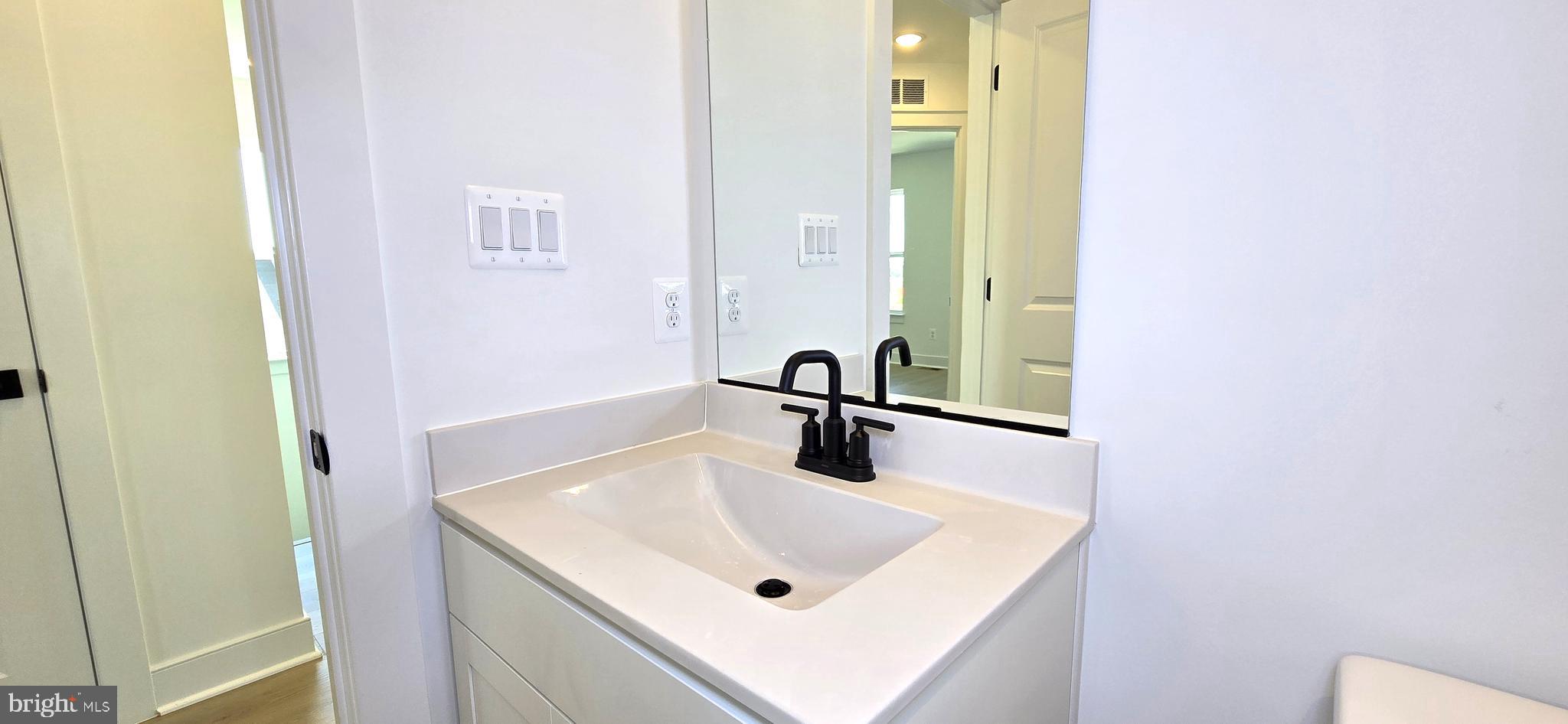 1726 Blacksmith Way Frederick, MD 21702 - Photo 51 of 64 a bathroom with a sink and a mirror