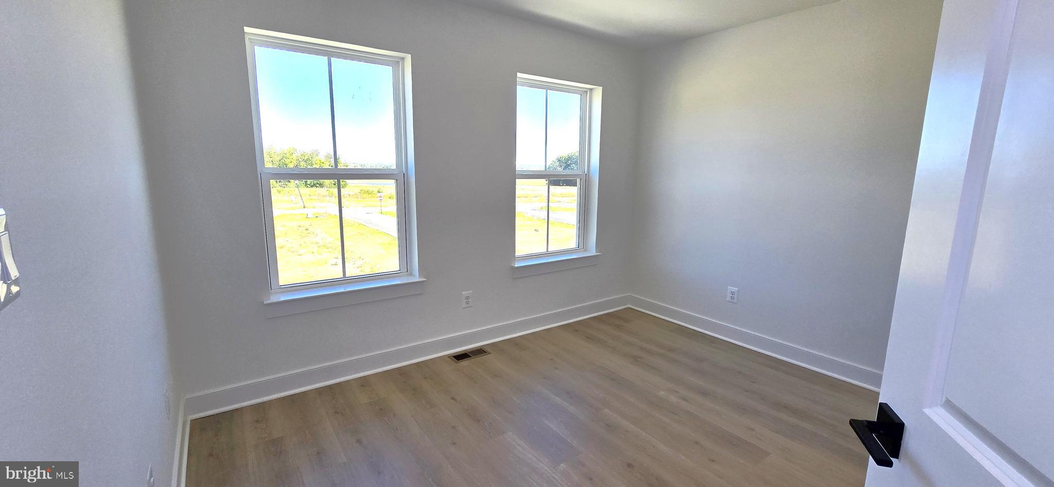 1726 Blacksmith Way Frederick, MD 21702 - Photo 52 of 64 an empty room with windows