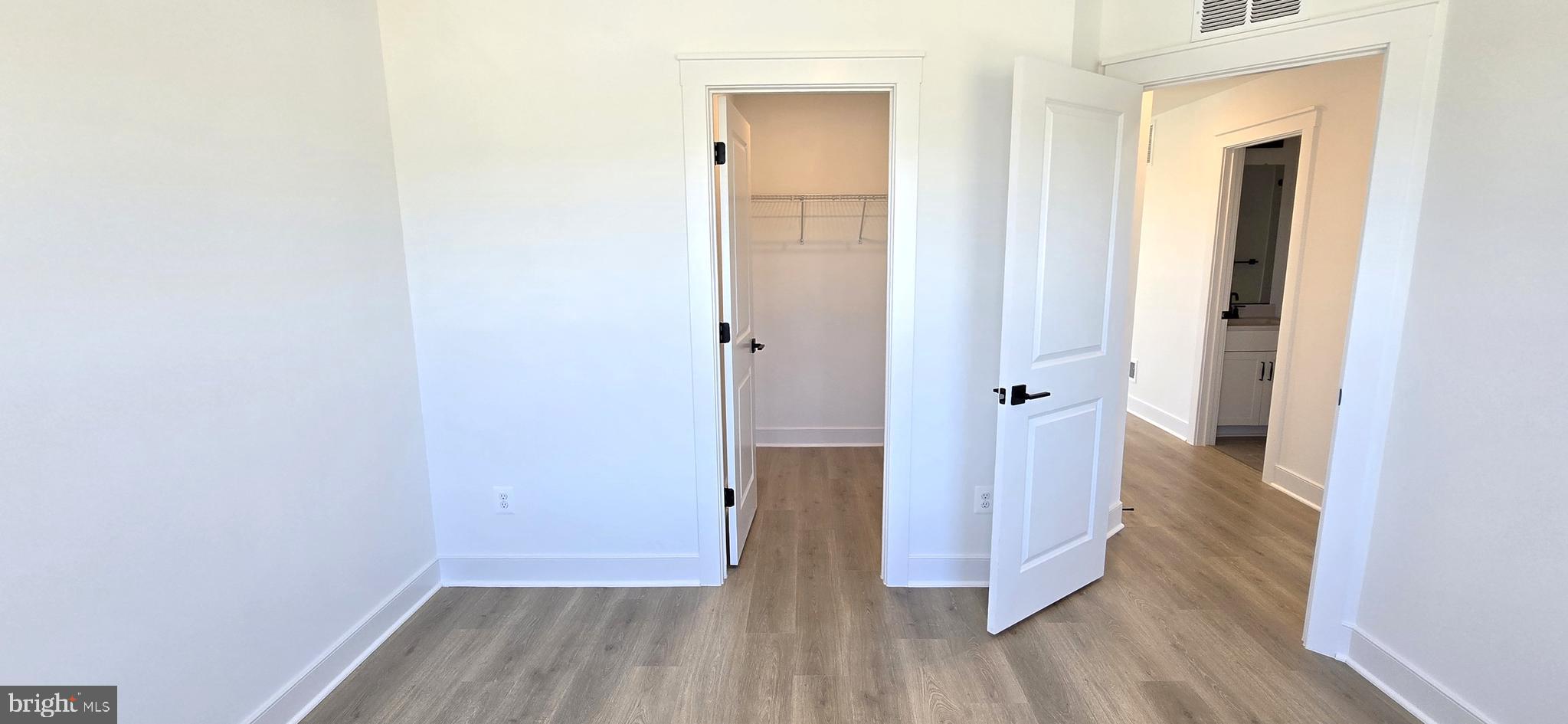 1726 Blacksmith Way Frederick, MD 21702 - Photo 53 of 64 a view of a hallway with wooden floor