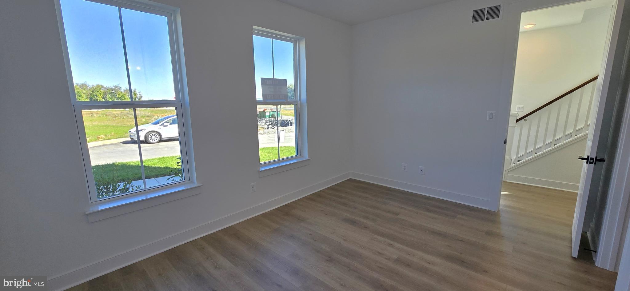 1726 Blacksmith Way Frederick, MD 21702 - Photo 8 of 64 wooden floor in an empty room with a window