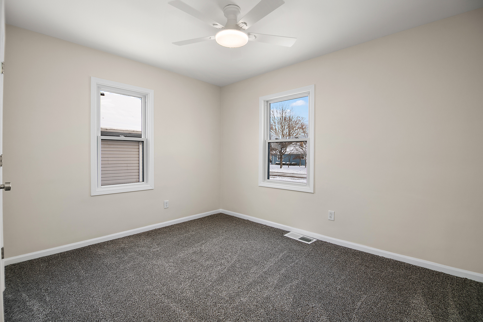 635 South Alma Avenue Kankakee, IL 60901 - Photo 11 of 21 an empty room with a window and a fan