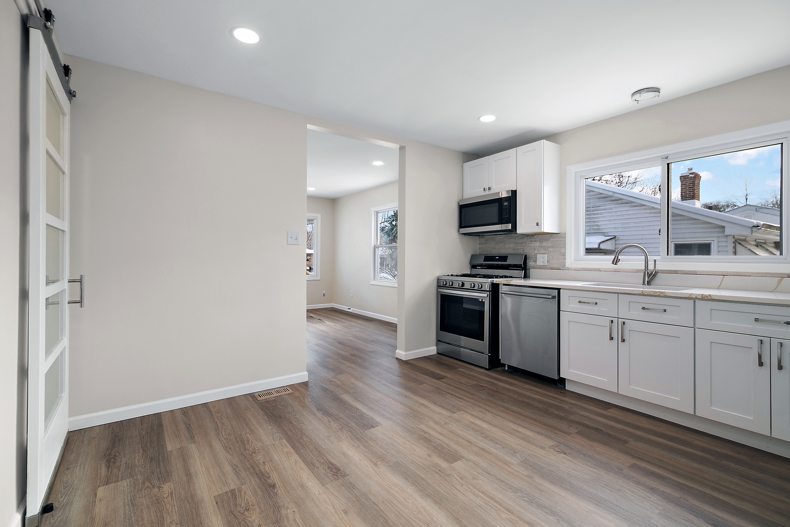 635 South Alma Avenue Kankakee, IL 60901 - Photo 9 of 21 a kitchen with a sink a microwave and cabinets