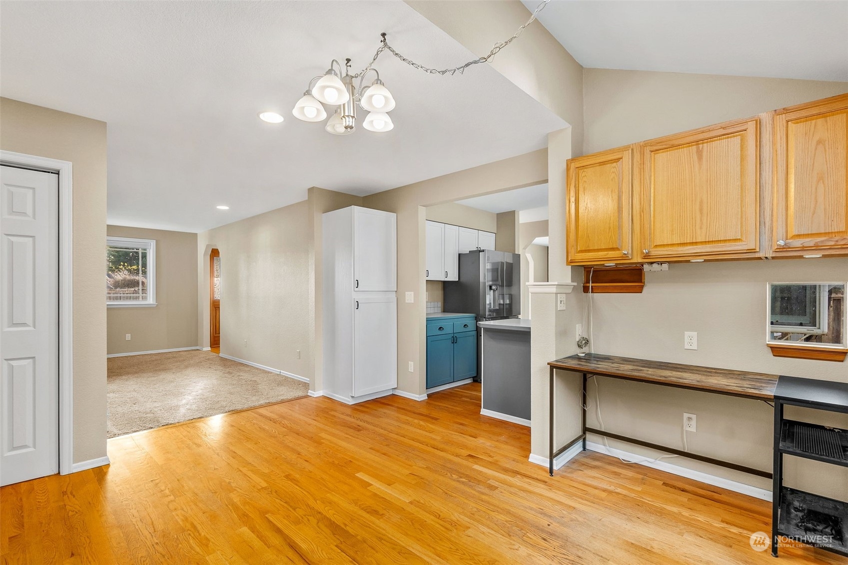 2517 Walnut Loop Northwest Olympia, WA 98502 - Photo 16 of 38 a room with stainless steel appliances kitchen island granite countertop furniture and a window