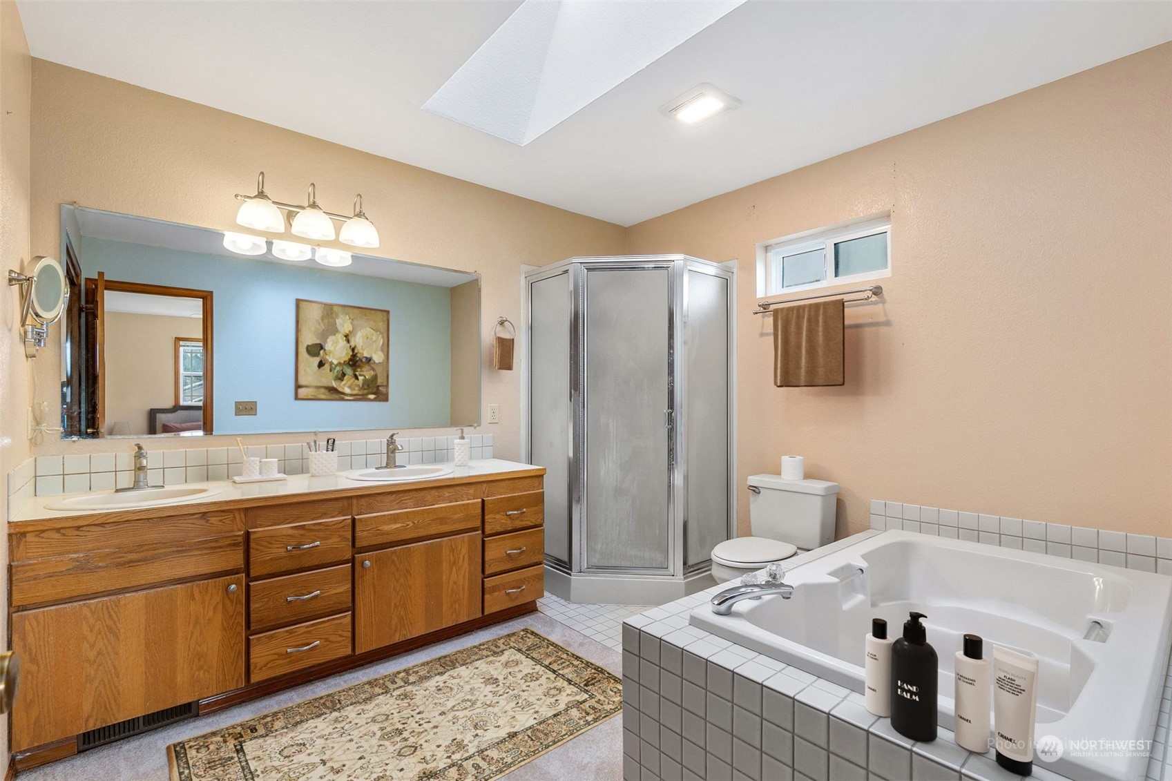 2517 Walnut Loop Northwest Olympia, WA 98502 - Photo 17 of 38 a spacious bathroom with a tub sink and mirror