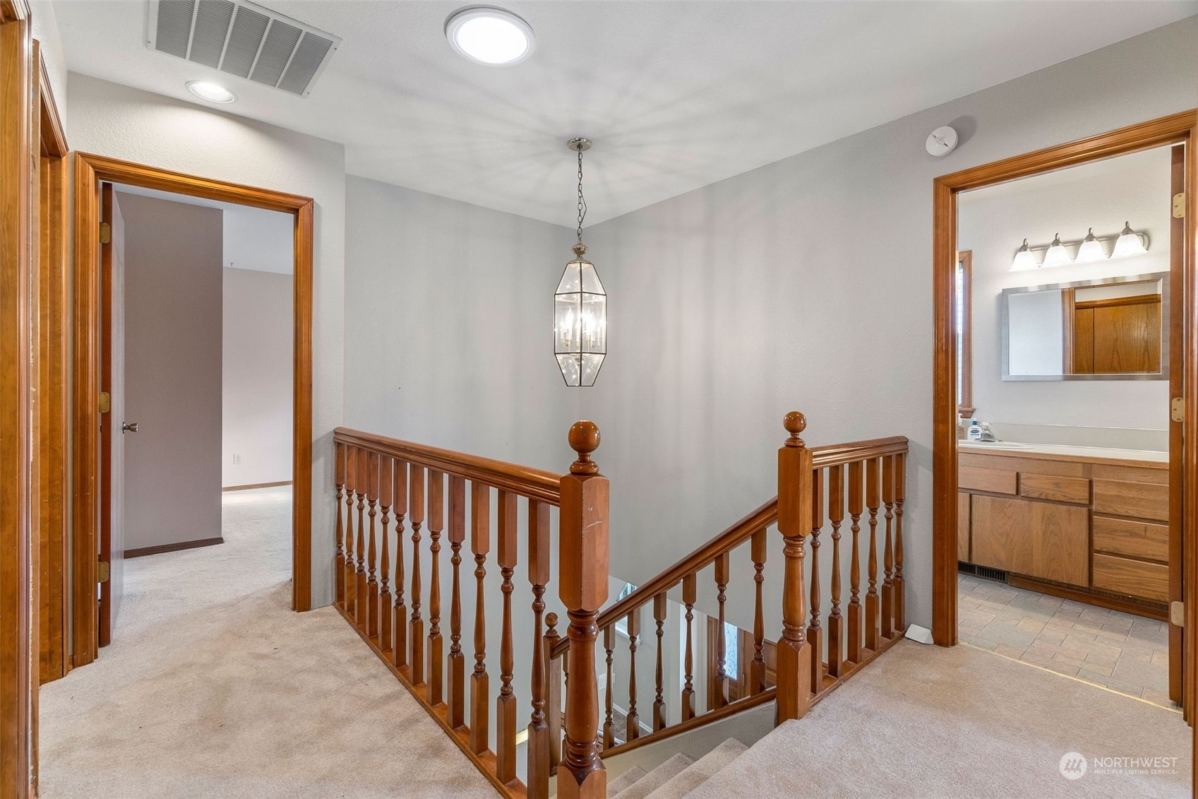 2517 Walnut Loop Northwest Olympia, WA 98502 - Photo 25 of 38 a view of a hallway to dining room and chandelier