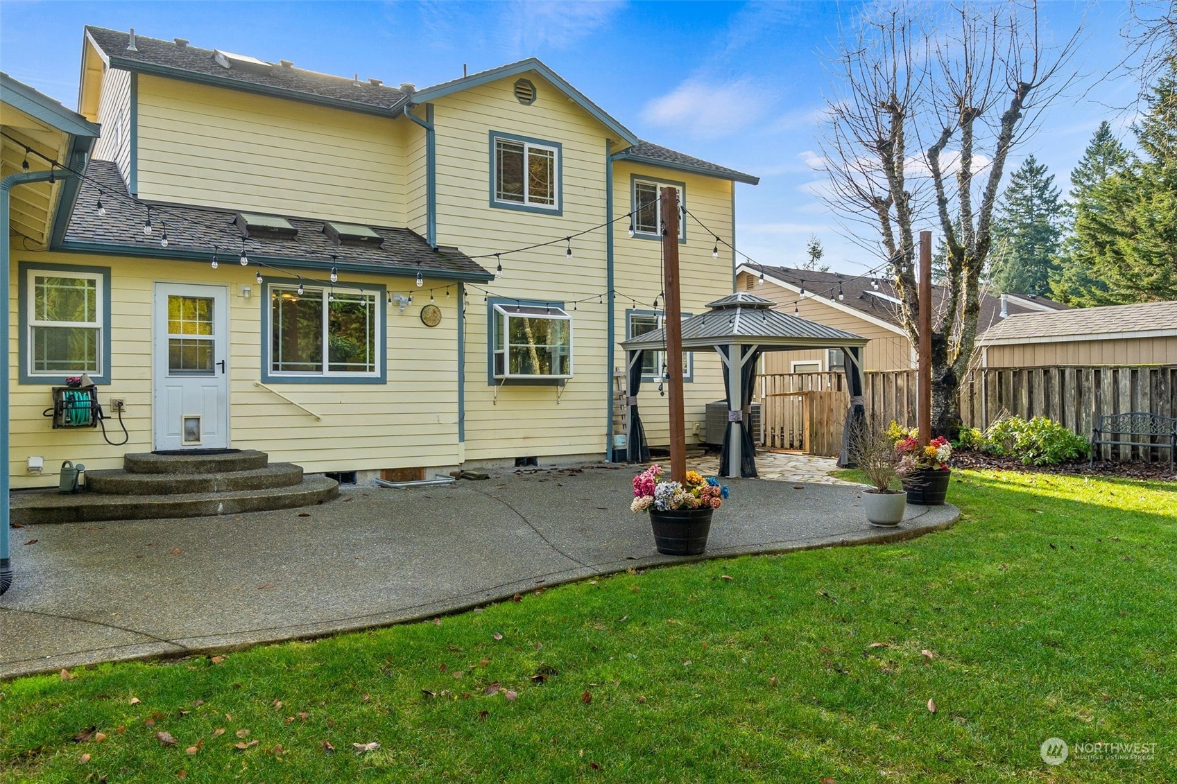 2517 Walnut Loop Northwest Olympia, WA 98502 - Photo 34 of 38 a front view of a house with patio and garden
