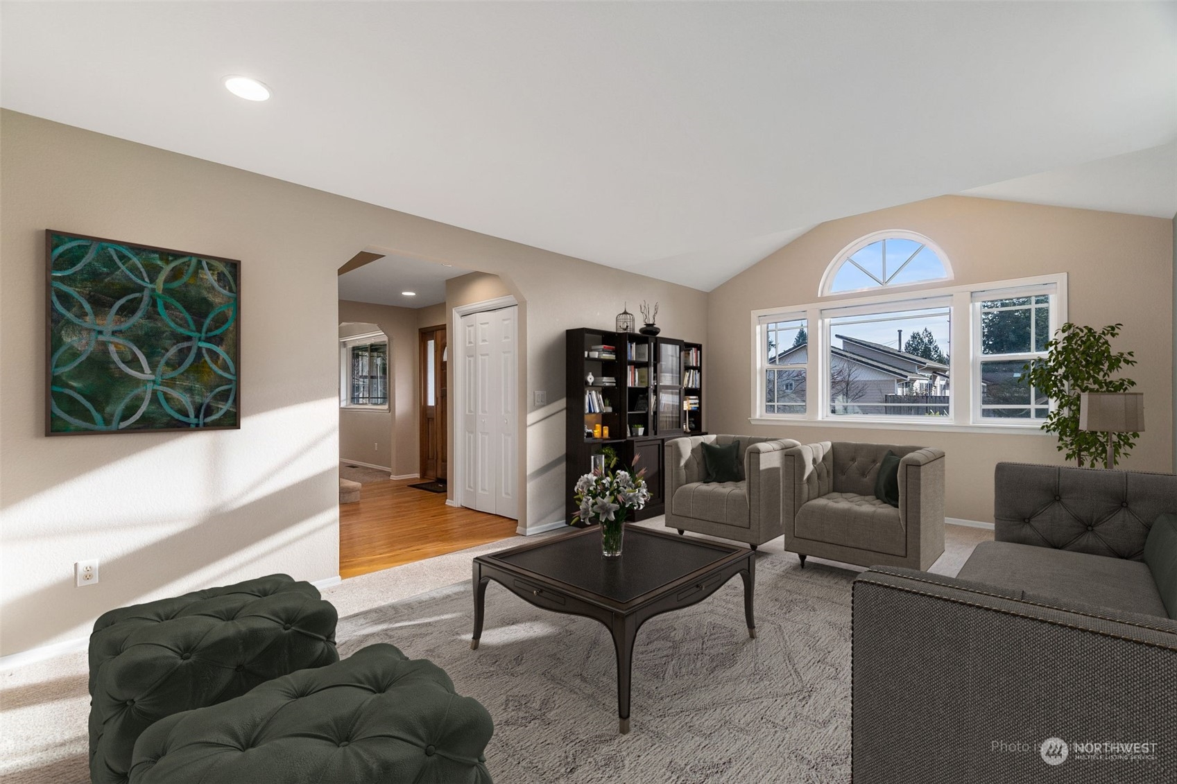 2517 Walnut Loop Northwest Olympia, WA 98502 - Photo 5 of 38 a living room with furniture a large window and a flat screen tv