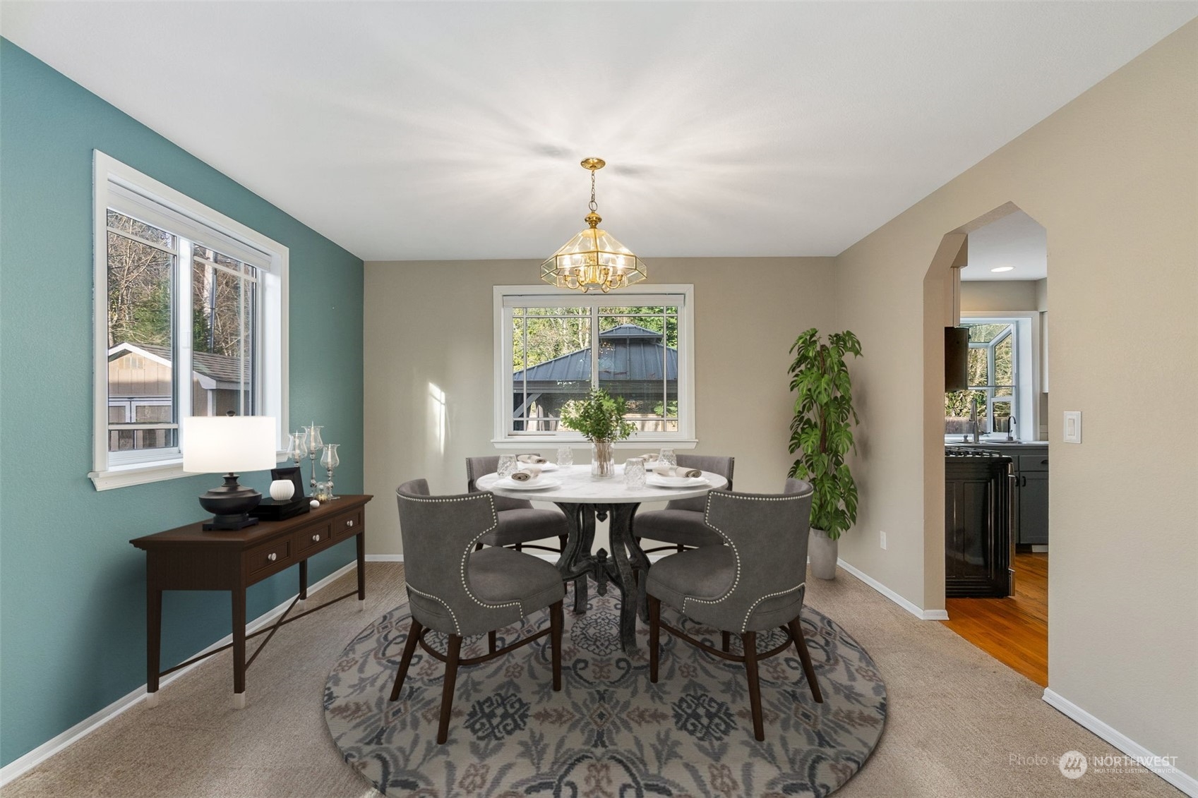 2517 Walnut Loop Northwest Olympia, WA 98502 - Photo 6 of 38 a dining room with furniture a chandelier and wooden floor