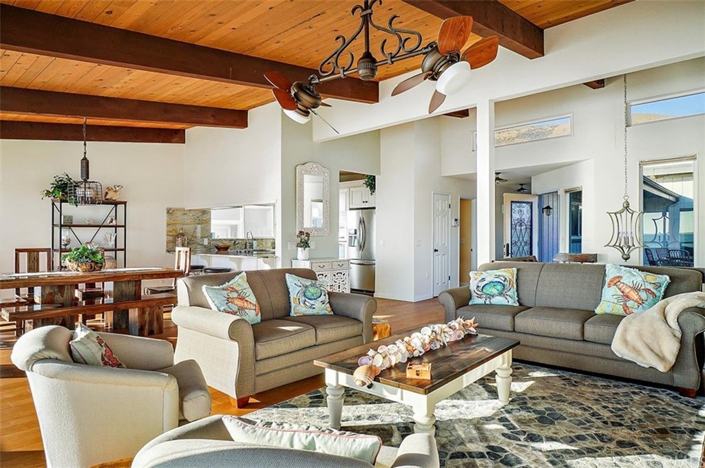 3498 Studio Drive Cayucos, CA 93430 - Photo 11 of 36 a living room with furniture and a chandelier