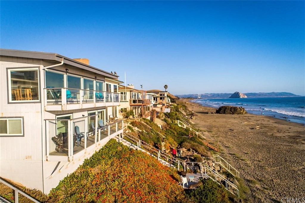 3498 Studio Drive Cayucos, CA 93430 - Photo 2 of 36 a view of a building with an ocean view