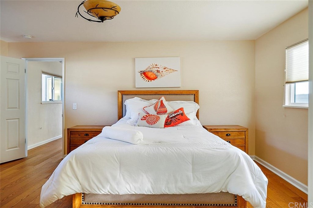 3498 Studio Drive Cayucos, CA 93430 - Photo 23 of 36 a bedroom with a bed and a window