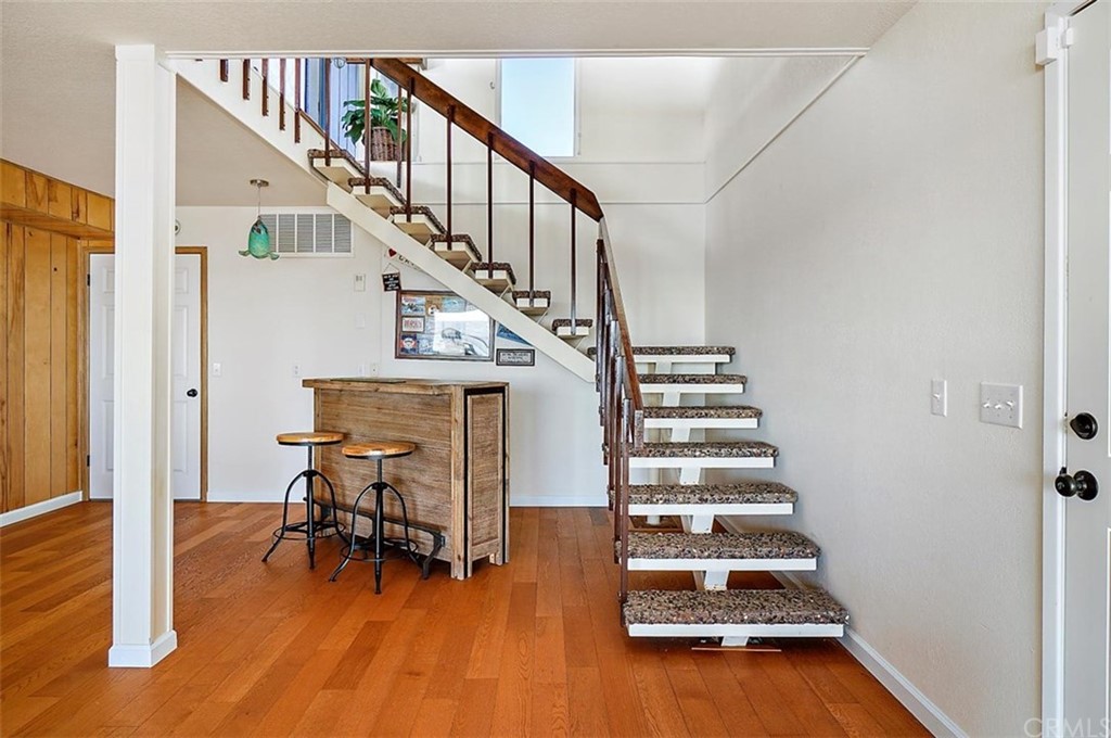 3498 Studio Drive Cayucos, CA 93430 - Photo 26 of 36 a view of entryway and hall with wooden floor