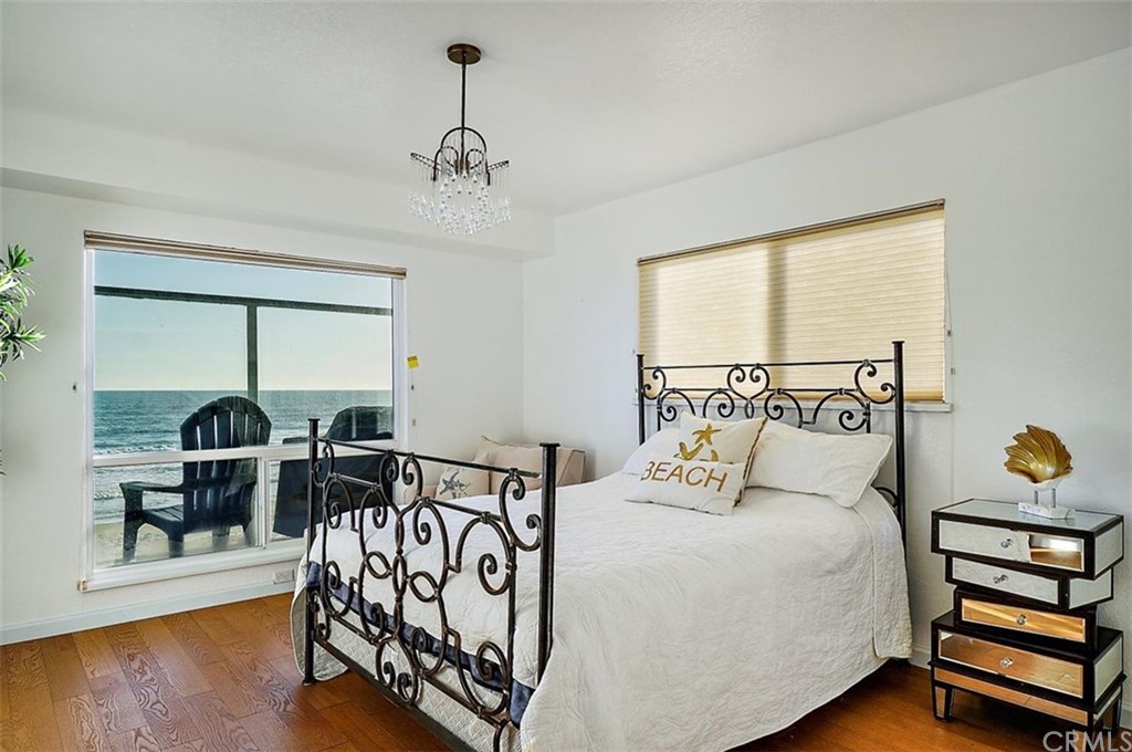 3498 Studio Drive Cayucos, CA 93430 - Photo 30 of 36 a bedroom with furniture and a window