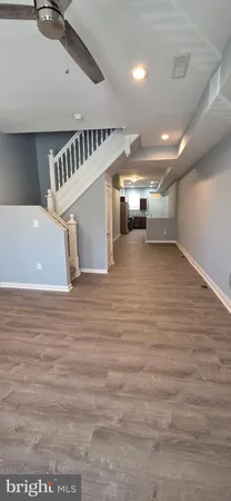 a view of a room with lots of wooden furniture