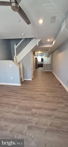 a view of a room with lots of wooden furniture