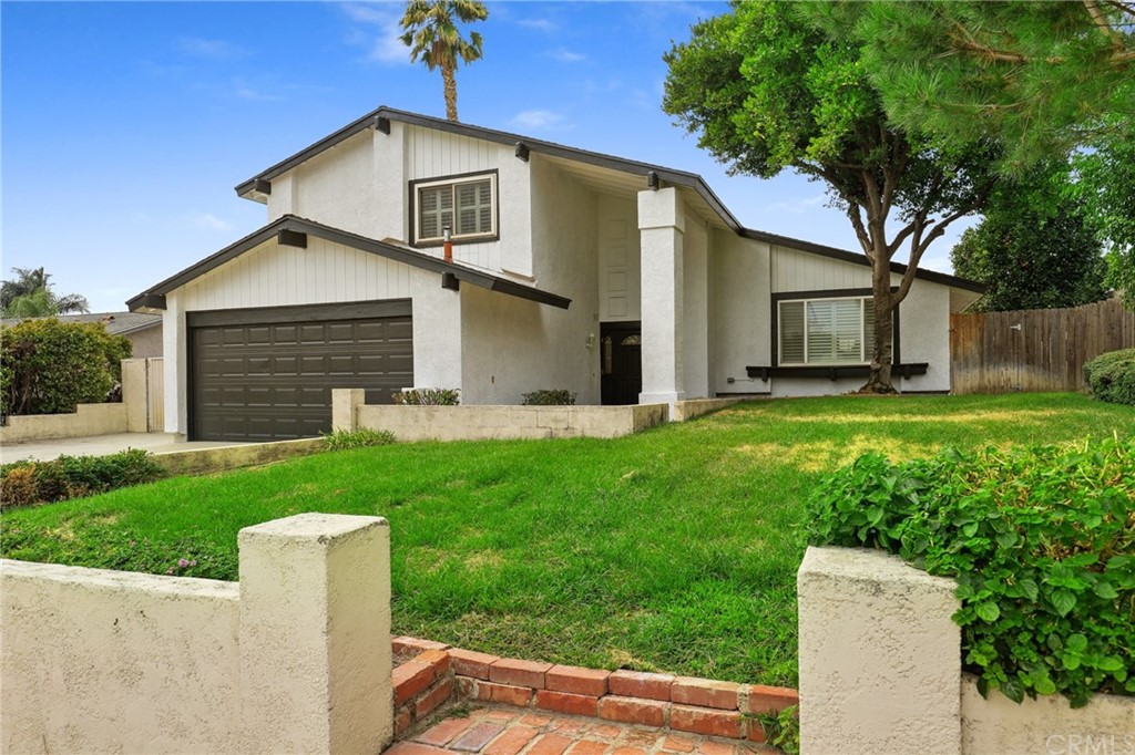 6780 Teak Way Rancho Cucamonga, CA 91701 - Photo 1 of 1 a front view of house with yard and green space