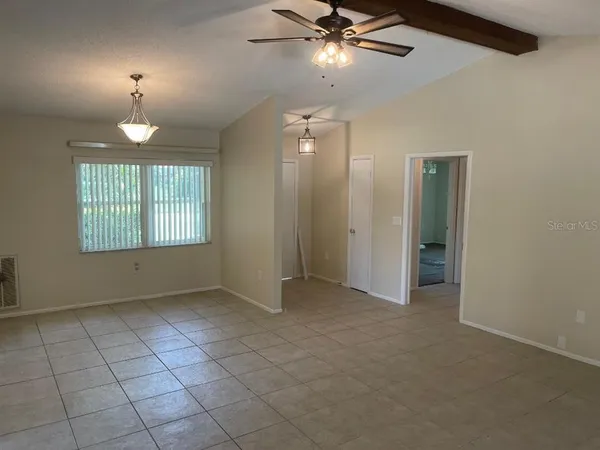 a view of a livingroom with a patio and a yard