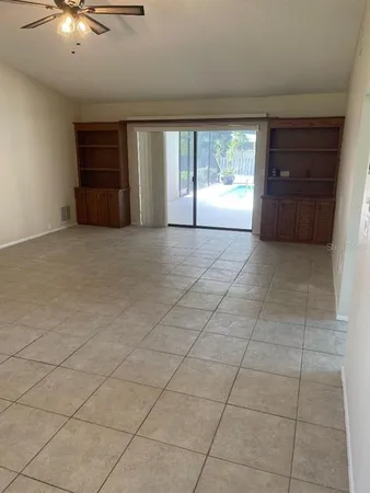 an empty room with windows and entrance