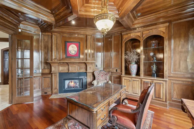 a view of a a dining room with furniture window and wooden floor